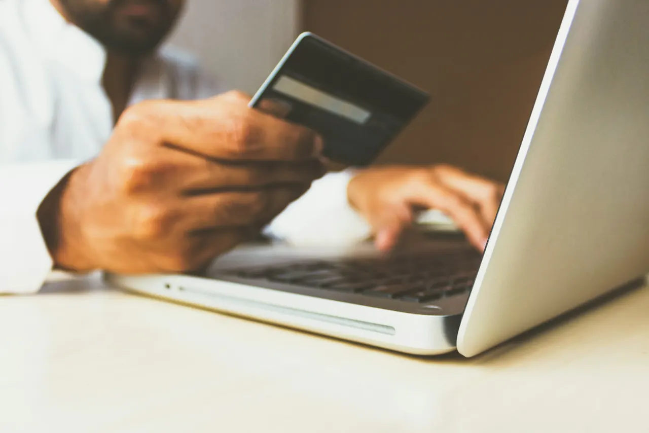 Payment card and laptop used for an online purchase
