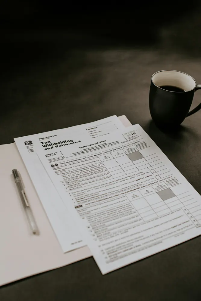 Financial paperwork and calculator for reviewing balances