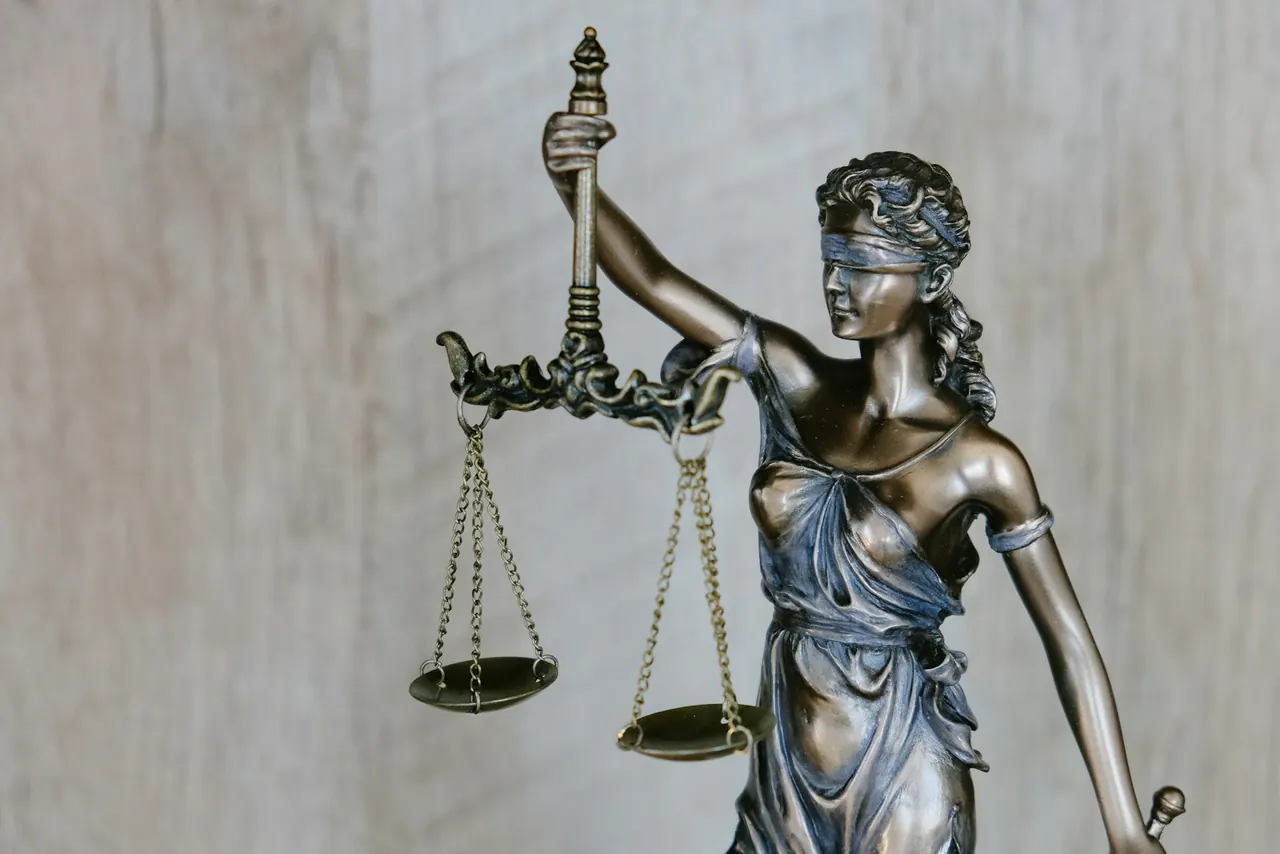 Lady Justice statue representing careful review of a collection notice