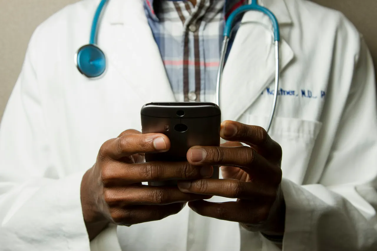 Medical professional reviewing information on a smartphone